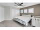 Bedroom features a metal bed frame, white shutters, and a white closet door at 4326 Spooner Lake Cir, Las Vegas, NV 89147