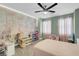 bedroom featuring a ceiling fan, curtains, and colorful playroom setup at 4326 Spooner Lake Cir, Las Vegas, NV 89147