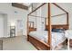 Bedroom with a four poster bed and a view to the ensuite bathroom at 4326 Spooner Lake Cir, Las Vegas, NV 89147