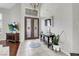 Elegant foyer with a decorative front door, high ceilings, and a tiled floor at 4326 Spooner Lake Cir, Las Vegas, NV 89147