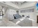 Open living space boasting a staircase, fireplace, and an abundance of natural light at 4326 Spooner Lake Cir, Las Vegas, NV 89147