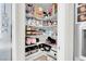 Organized pantry with ample shelving, holding an array of food, appliances, and storage items at 4326 Spooner Lake Cir, Las Vegas, NV 89147