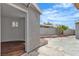 Backyard view with gray stucco walls, a paved patio, and a palm tree at 4404 Hillcrest Ave, Las Vegas, NV 89102