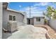 Backyard with gray stucco walls, a paved patio, and an air conditioning unit at 4404 Hillcrest Ave, Las Vegas, NV 89102