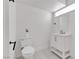 Clean bathroom features a white vanity, toilet, modern fixtures, and a well-lit mirror at 4404 Hillcrest Ave, Las Vegas, NV 89102