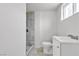 Bright bathroom features a shower with marble tiling and a modern vanity at 4404 Hillcrest Ave, Las Vegas, NV 89102
