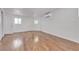 A bedroom with hardwood floors, bright white walls, and climate control at 4404 Hillcrest Ave, Las Vegas, NV 89102