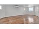 Spacious bedroom featuring hardwood floors, bright white walls, and climate control at 4404 Hillcrest Ave, Las Vegas, NV 89102