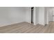 A simple bedroom featuring light wood flooring and a closet at 4404 Hillcrest Ave, Las Vegas, NV 89102