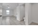 Spacious bedroom with light gray tile floors, a large window, and an attached toilet room at 4404 Hillcrest Ave, Las Vegas, NV 89102