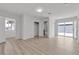 Spacious primary bedroom with laminate floors, walk-in closet, and an en-suite bathroom, perfect for relaxation at 4404 Hillcrest Ave, Las Vegas, NV 89102