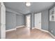 Bright bedroom with hardwood floors, a window, and a light fixture at 4404 Hillcrest Ave, Las Vegas, NV 89102