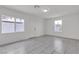 Bedroom with two windows and tile flooring at 4404 Hillcrest Ave, Las Vegas, NV 89102