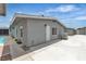 Exterior view of home features a concrete patio and a sparkling swimming pool at 4404 Hillcrest Ave, Las Vegas, NV 89102