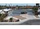 Charming single-story home with an orange door, grey exterior paint, desert landscaping and a long driveway at 4404 Hillcrest Ave, Las Vegas, NV 89102