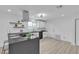 Modern kitchen with white cabinets, stainless steel appliances, and sleek countertops at 4404 Hillcrest Ave, Las Vegas, NV 89102