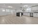 Bright, open-concept kitchen featuring white cabinets, stainless steel appliances and an island at 4404 Hillcrest Ave, Las Vegas, NV 89102
