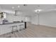 Open living space with wood-look floors, an eat-in kitchen, and a large living area at 4404 Hillcrest Ave, Las Vegas, NV 89102