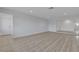 Bright and spacious living room featuring stylish laminate flooring, recessed lighting, and a neutral color palette at 4404 Hillcrest Ave, Las Vegas, NV 89102