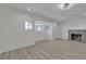 Bright living room featuring stylish flooring, ample natural light, and a modern fireplace at 4404 Hillcrest Ave, Las Vegas, NV 89102