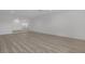 Expansive open-concept living room with modern laminate floors and recessed lighting, perfect for entertaining at 4404 Hillcrest Ave, Las Vegas, NV 89102