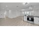 Open-concept living room with recessed lighting, wood-style floors, and a modern kitchen at 4404 Hillcrest Ave, Las Vegas, NV 89102