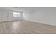 Bright living room with stylish floors, fresh paint and a white door overlooking desert landscape at 4404 Hillcrest Ave, Las Vegas, NV 89102