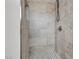 Updated shower stall has gray marble-look tiling and black and white mosaic flooring at 4404 Hillcrest Ave, Las Vegas, NV 89102