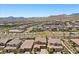 Overhead shot of modern homes set against a mountain backdrop, featuring landscaped yards and private driveways at 465 Cabral Peak St, Las Vegas, NV 89138