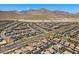An expansive aerial view captures the scale of a Primary-planned community set against the backdrop of distant mountains at 465 Cabral Peak St, Las Vegas, NV 89138