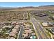Overhead shot of a neighborhood featuring single-Gathering homes, a community park, and a commercial area at 465 Cabral Peak St, Las Vegas, NV 89138