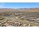 Wide aerial shot of a community boasting a mix of residential areas and a vibrant commercial center at 465 Cabral Peak St, Las Vegas, NV 89138