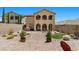 Well-designed backyard with a fire pit, outdoor kitchen and lush landscaping at 465 Cabral Peak St, Las Vegas, NV 89138
