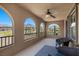 Inviting balcony with mountain views, ceiling fan, arched windows and seating area at 465 Cabral Peak St, Las Vegas, NV 89138