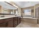 A spacious bathroom with double sinks, a separate shower, and soaking tub offers a luxurious retreat at 465 Cabral Peak St, Las Vegas, NV 89138