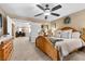 Comfortable bedroom with carpet, ceiling fan and furniture, leading to other rooms and office area at 465 Cabral Peak St, Las Vegas, NV 89138