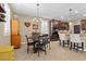Charming dining area features a chandelier, seating for four, and seamlessly connects to the kitchen and living areas at 465 Cabral Peak St, Las Vegas, NV 89138