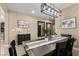 Bright dining room with wooden table, natural light, and neutral paint at 465 Cabral Peak St, Las Vegas, NV 89138