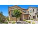 Charming two-story stucco home with a well-manicured yard and inviting curb appeal at 465 Cabral Peak St, Las Vegas, NV 89138