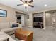 Comfortable living room featuring neutral carpet, a ceiling fan and comfortable seating at 465 Cabral Peak St, Las Vegas, NV 89138