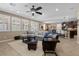 Bright, open living room with plantation shutters, ceiling fan, and stylish furnishings for relaxing at 465 Cabral Peak St, Las Vegas, NV 89138