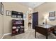 Functional home office with a bookshelf, desk, and stylish décor provides an efficient workspace at 465 Cabral Peak St, Las Vegas, NV 89138