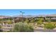 Street-level view of modern homes with desert landscaping, complemented by scenic mountain views in the distance at 465 Cabral Peak St, Las Vegas, NV 89138