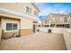 Low-maintenance backyard with gravel and a white fence, ready for outdoor entertaining and relaxation at 4833 Straight Flush Dr # 103, Las Vegas, NV 89122