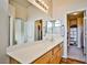 Bathroom featuring a spacious vanity area with a sink and ample storage with access to the walk-in closet at 4833 Straight Flush Dr # 103, Las Vegas, NV 89122