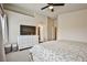 Spacious bedroom with a large dresser, walk-in closet, and neutral tones creating a relaxing atmosphere at 4833 Straight Flush Dr # 103, Las Vegas, NV 89122