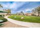 Community park featuring a large grassy area, picnic benches, and mature trees at 4833 Straight Flush Dr # 103, Las Vegas, NV 89122
