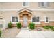 Charming front entrance featuring a decorative door and manicured shrubbery at 4833 Straight Flush Dr # 103, Las Vegas, NV 89122