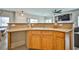 Kitchen sink with bar seating to the left and living room in the background at 4833 Straight Flush Dr # 103, Las Vegas, NV 89122