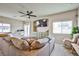 Inviting living room area featuring large sectional sofa, and custom built-in entertainment center at 4833 Straight Flush Dr # 103, Las Vegas, NV 89122